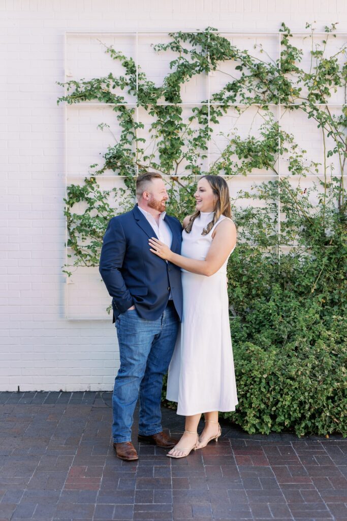 Couple standing close together during golden hour at Turtle Creek
