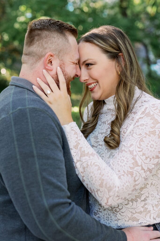 Close up of Ryan and Madeline smiling at each other during their engagement session